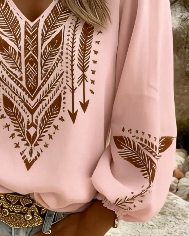 Blusa de mangas voluminosas con cuello en V amplio