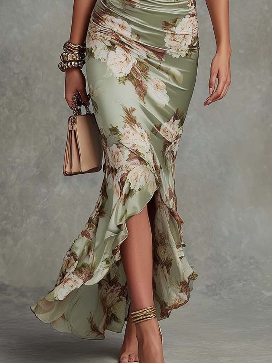 Anna - Vestido largo asimétrico de satén verde con escote en V, mangas acampanadas fruncidas y motivo floral.