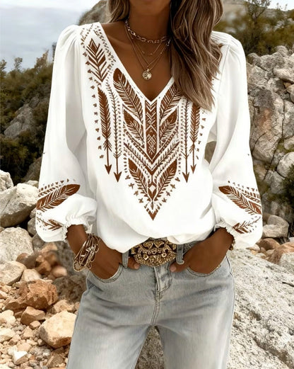 Blusa de mangas voluminosas con cuello en V amplio