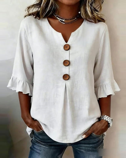 Blusa con cuello en V, botones de madera y mangas con volante