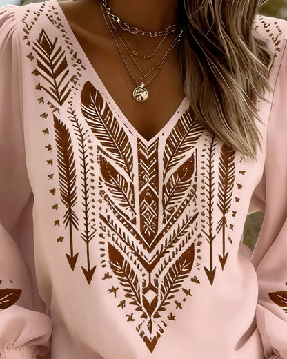Blusa de mangas voluminosas con cuello en V amplio