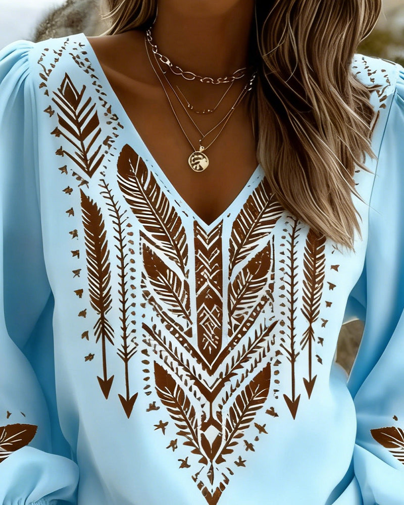 Blusa de mangas voluminosas con cuello en V amplio
