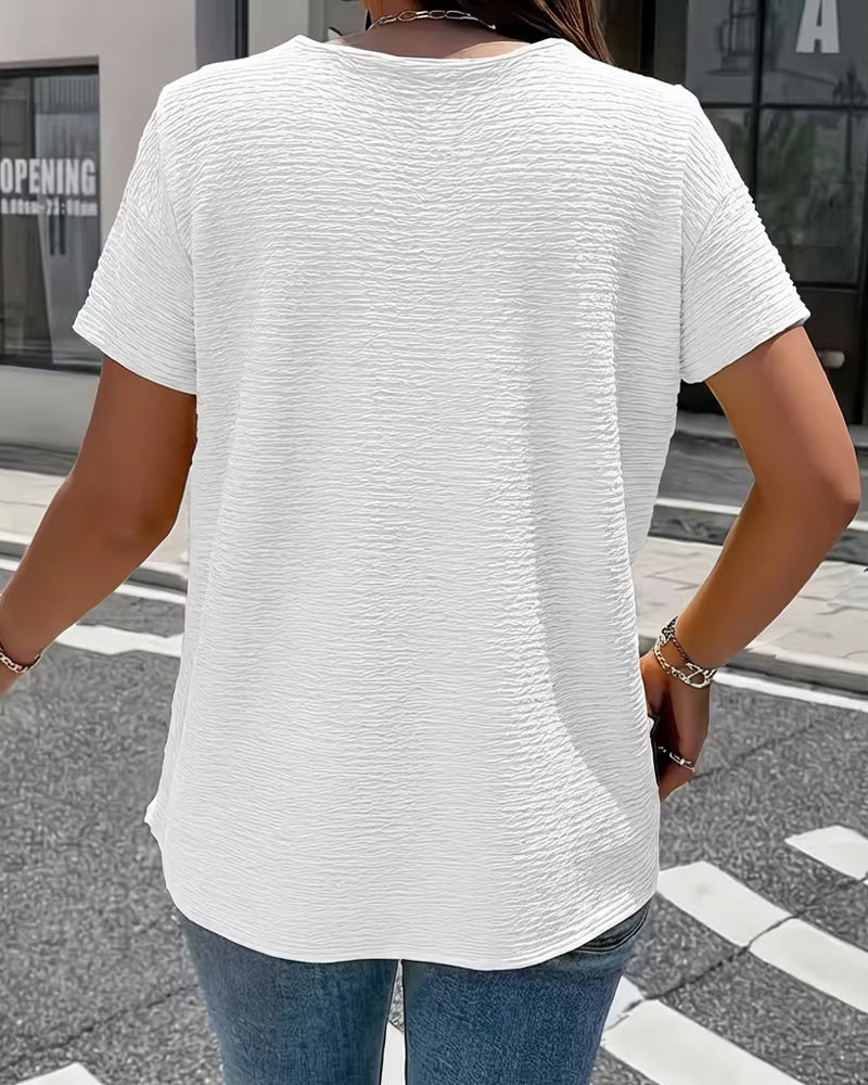 Camiseta con cuello Peter Pan y botones