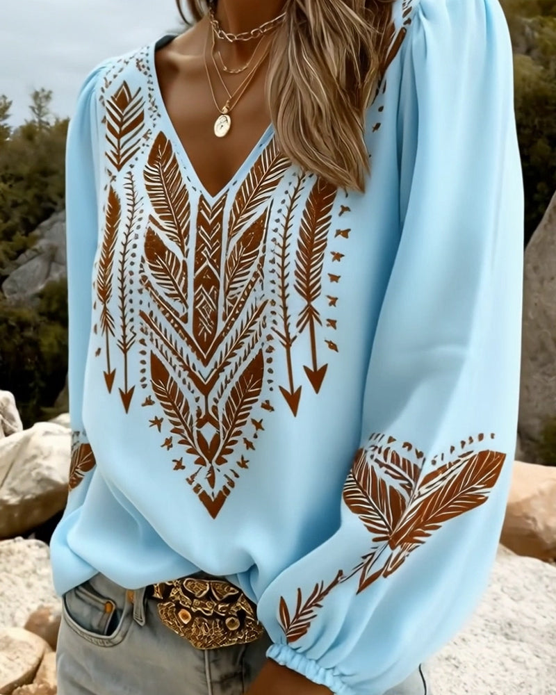 Blusa de mangas voluminosas con cuello en V amplio